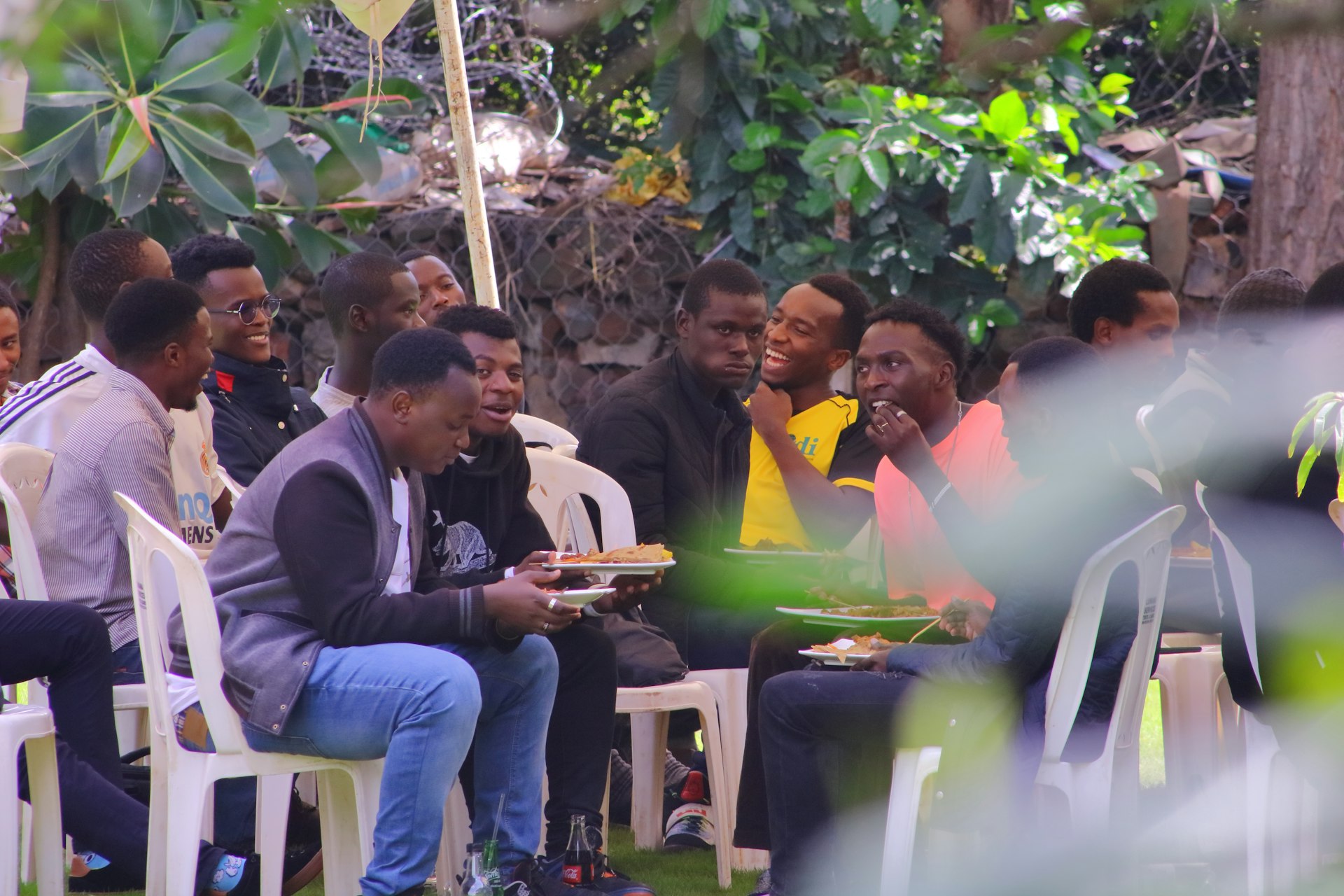 a group of people sitting outside